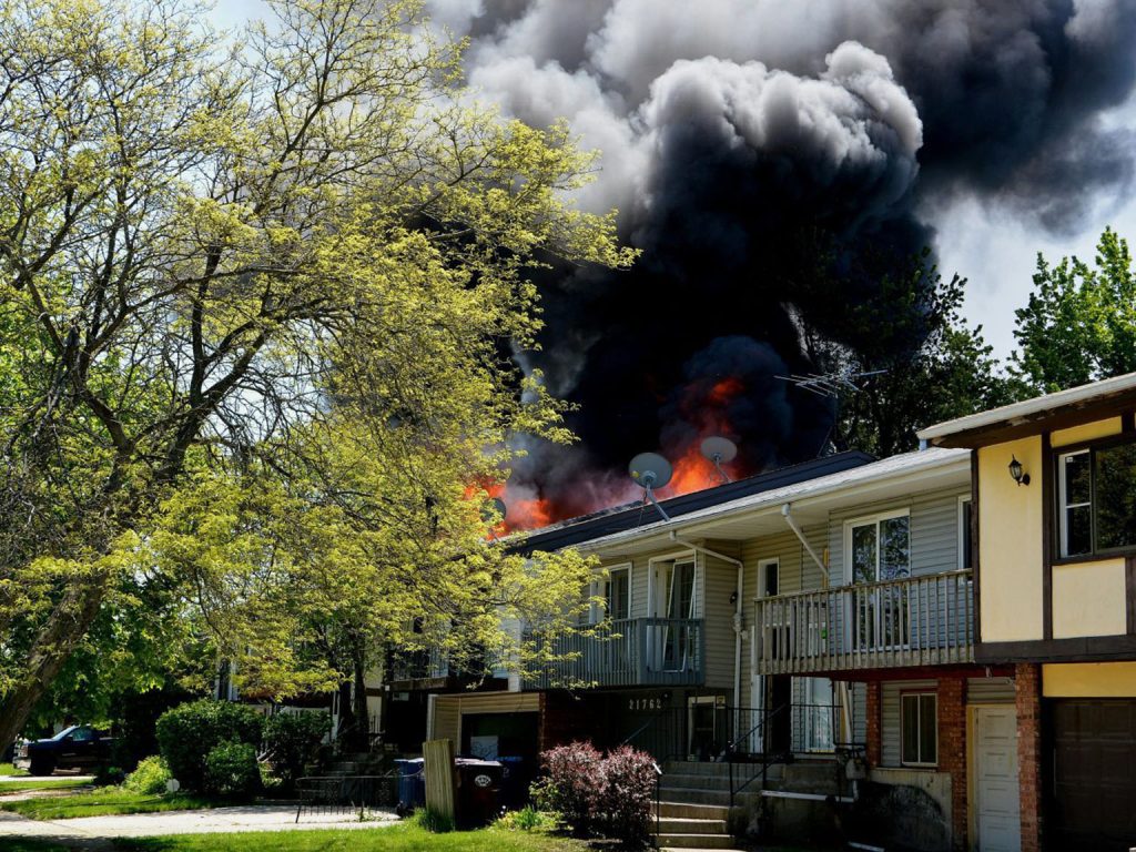 House fire with heavy smoke on the roof